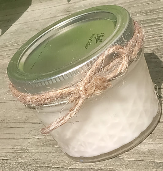 White Small Jar Candle with twine bow, dried herbs, and glitter